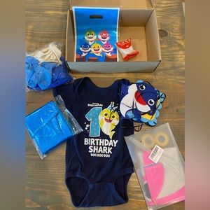 Baby Shark First Birthday Party supplies and onesie
